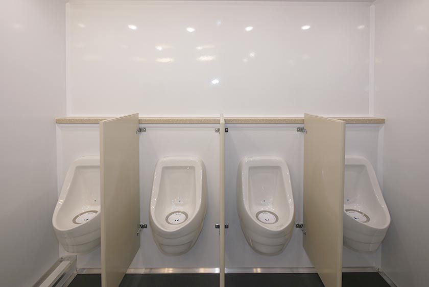 FOUR PORCELAIN URINALS ON THE MEN'S SIDE