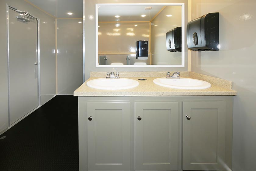 LARGE MIRROR OVER VANITY WITH TWO SINKS AND UNDER CABINET STORAGE