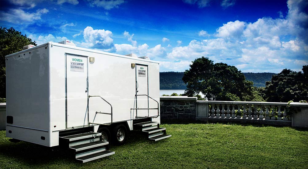 The Westchester Restroom Trailer By A Scenic View