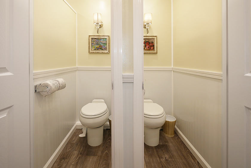 EACH PRIVATE TOILET STALL HAS FLOOR TO CEILING LOCKABLE DOOR