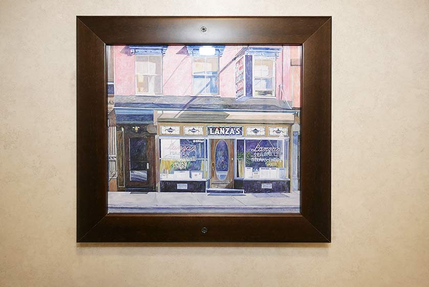 ARTWORK HAS CUSTOM FRAMING TO MATCH THE WOOD DECOR