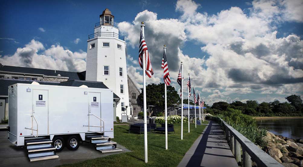 Restroom Trailers | NYC | The Yachtsman Luxury Restroom Trailer By A Light House