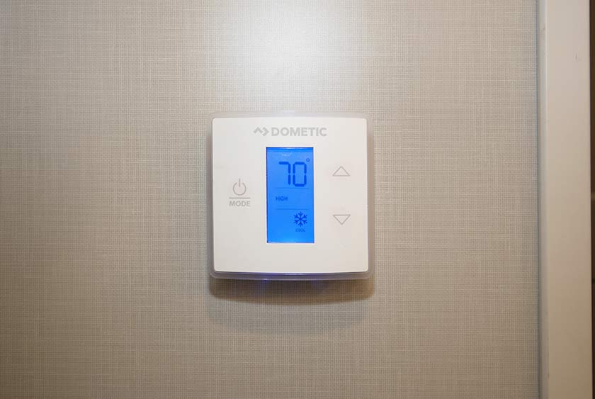 THERMOSTAT CONTROLLED AIR CONDITIONING FOR COMFORT