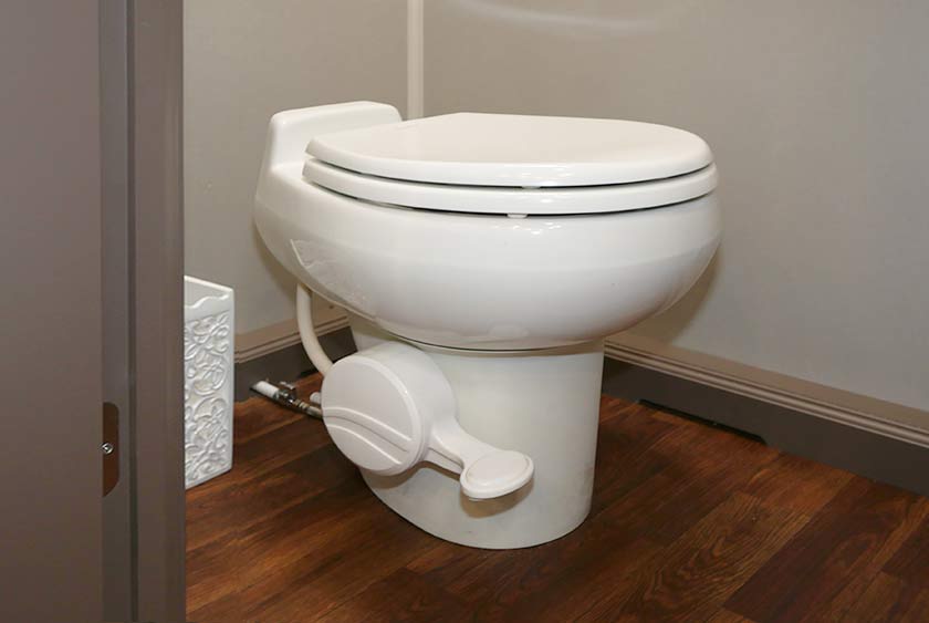 FULL SIZED PORCELAIN TOILETS IN ALL STALLS