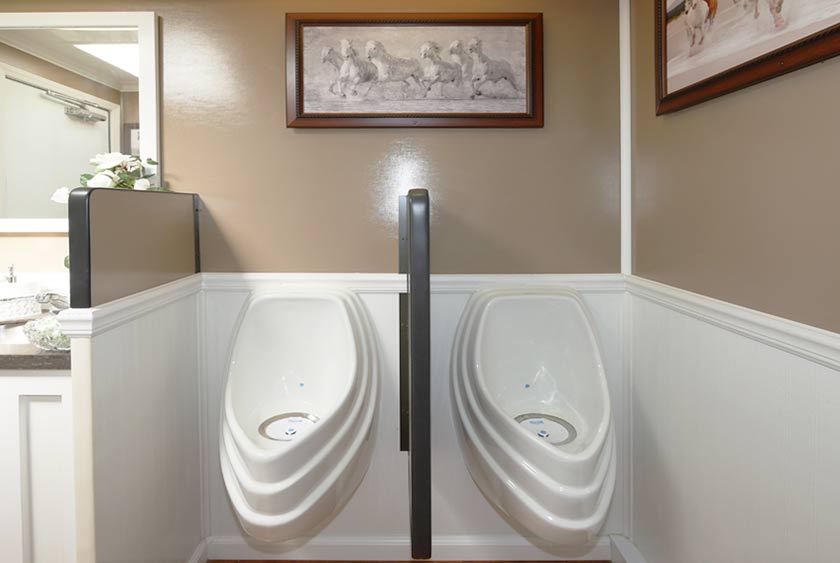 TWO SLOAN ODORLESS URINALS ON THE MEN'S SIDE