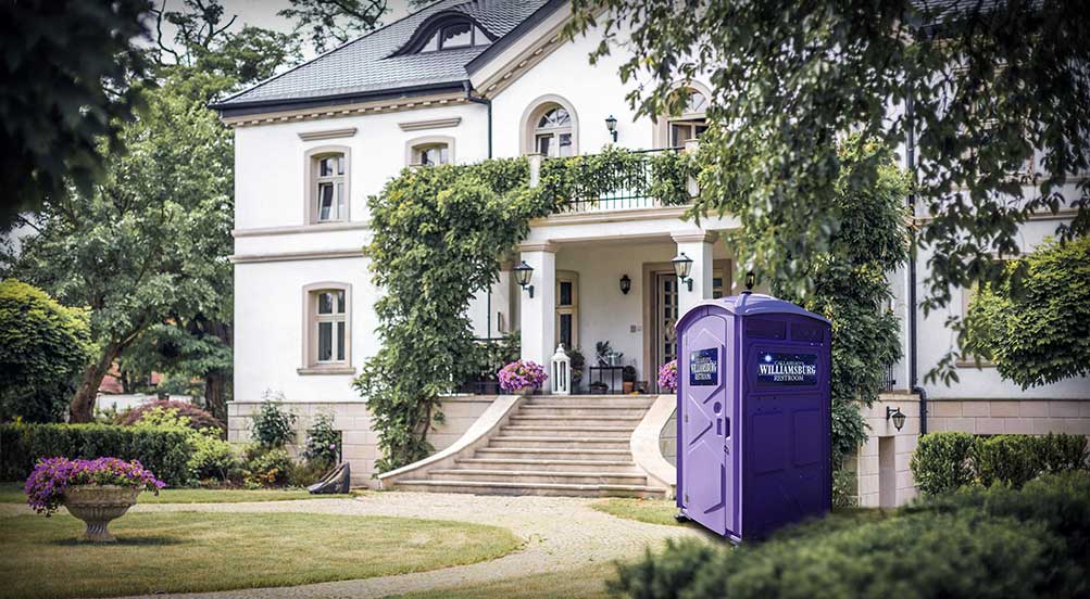 The Williamsburg Portable Toilet Near A House